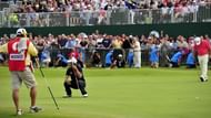 Adam Scott of Australia reacts after missing his putt to tie the championship on the 18th green